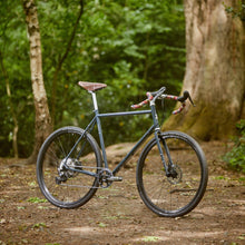 Load image into Gallery viewer, Bicycle on a dirt path in a forest
