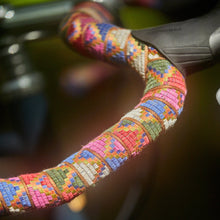 Load image into Gallery viewer, Colorful woven handle bar wrap with blurred background
